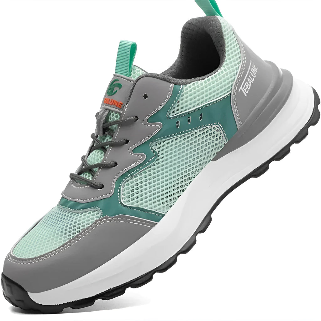 Green low-top work shoes with mesh panels and a plastic steel toe cap on a TPU sole