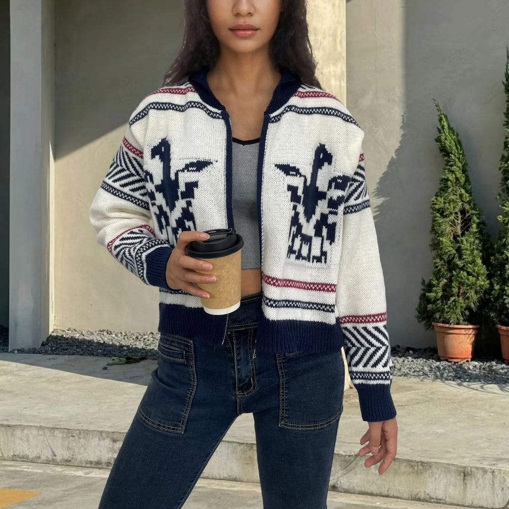 White women's cardigan sweater with a front zipper, lapel collar, and a vertical jacquard contrast stripe.