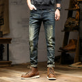 Men's skinny fit jeans in retro blue denim with a zip fly, shown laid flat.
