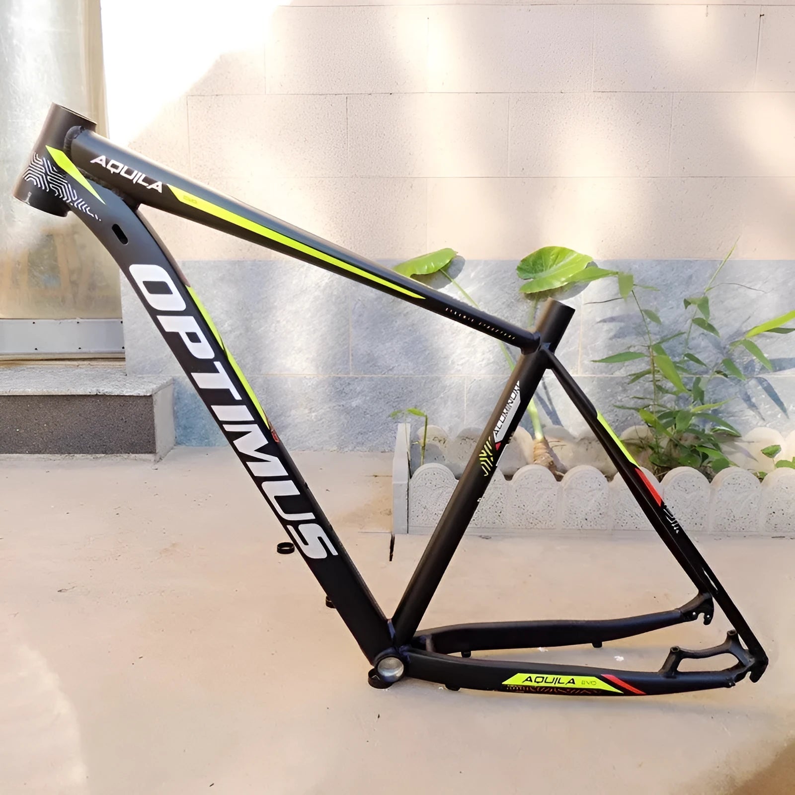 Black green aluminium 29-inch mountain bike frame with disc brake mounts and internal cable routing ports.