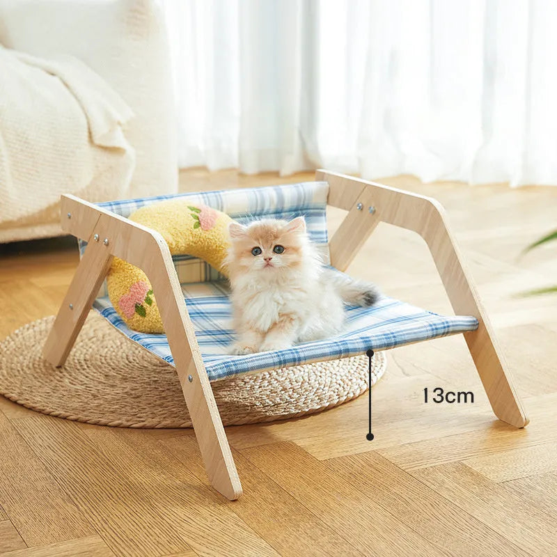 Elevated wood frame cat hammock bed with soft cloth covering in beach chair style design