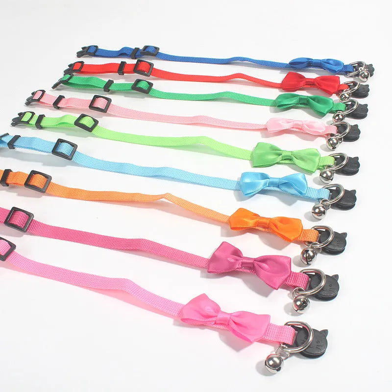 Adjustable nylon cat collar with decorative bow and bell in multiple colour options