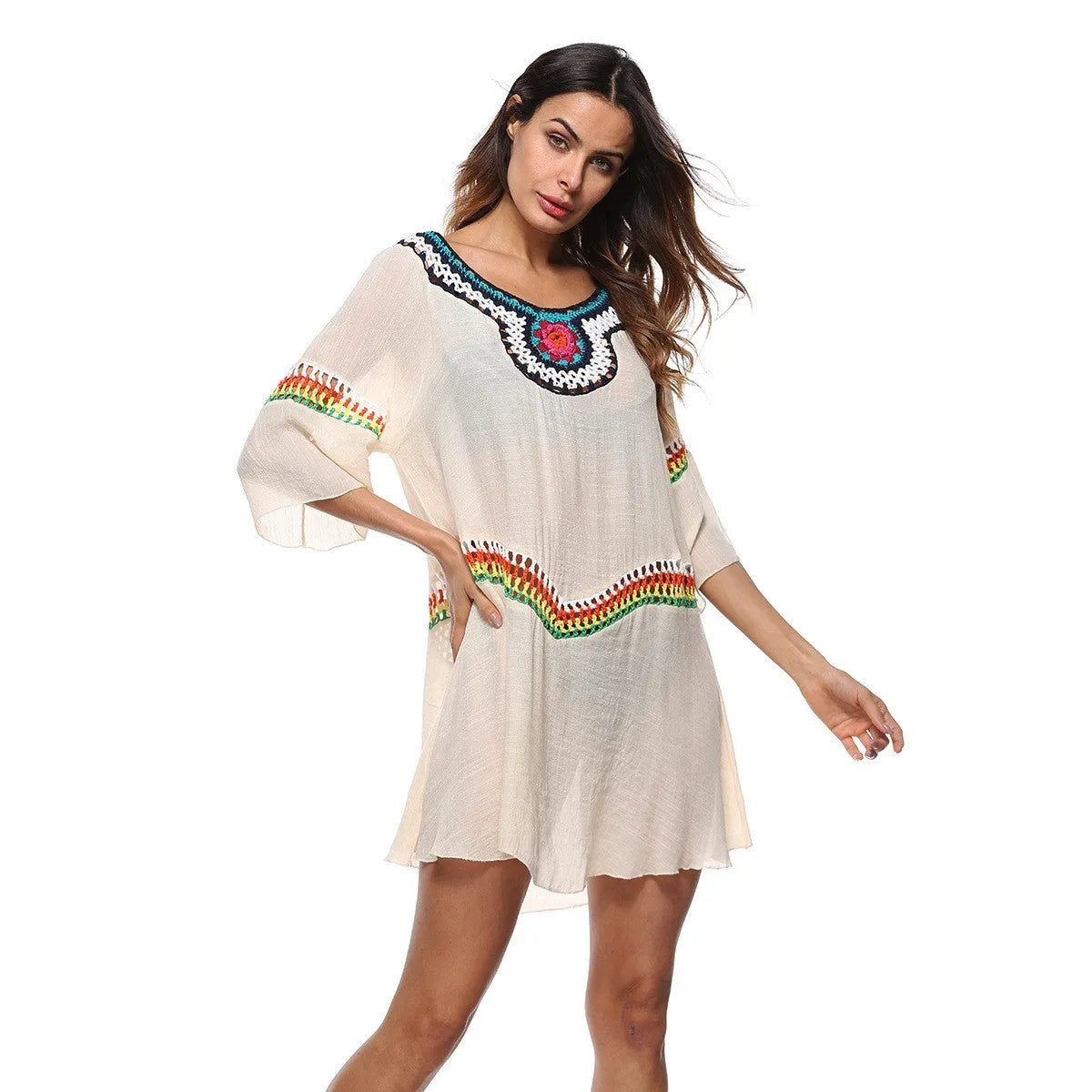 Crocheted ethnic-style beach cover-up for women in apricot colour, made from acrylic fabric.
