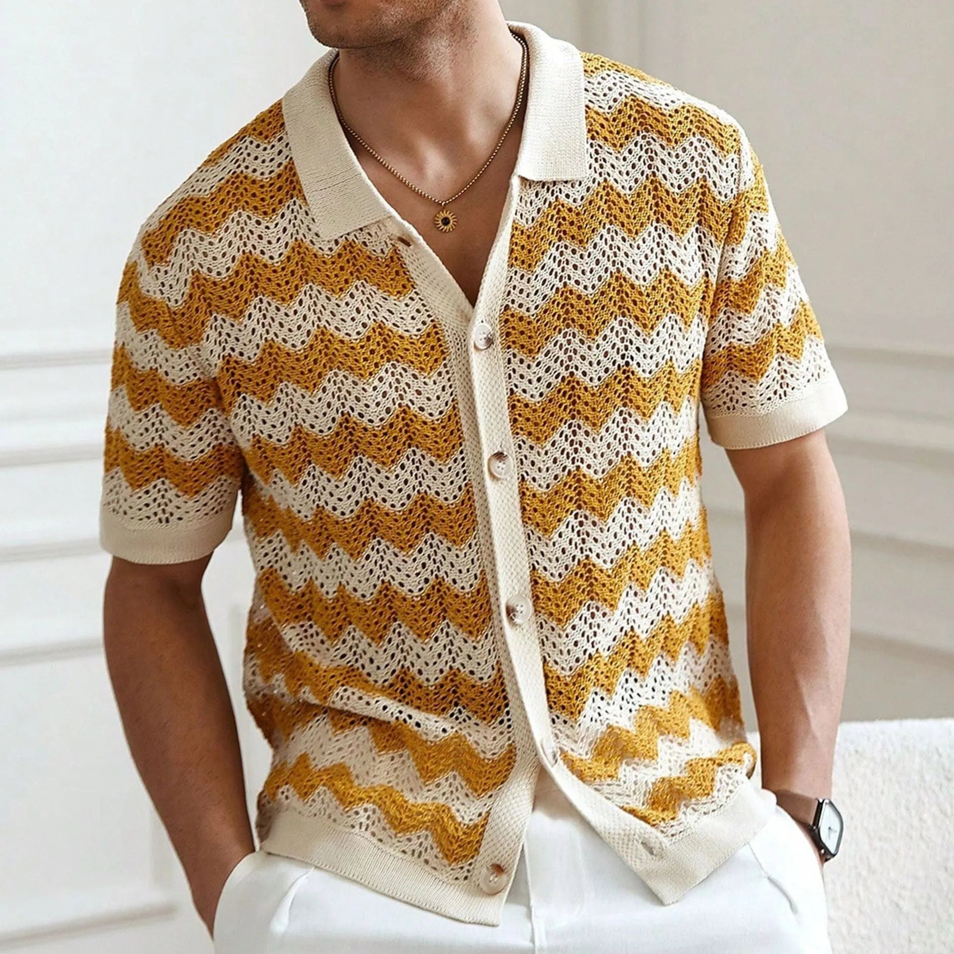 Man wearing a yellow hollow jacquard corrugated short sleeve sweater in an American casual style.