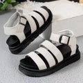 Thick sole buckle strap sandals in black, white, or orange colours showing PU upper and rubber sole