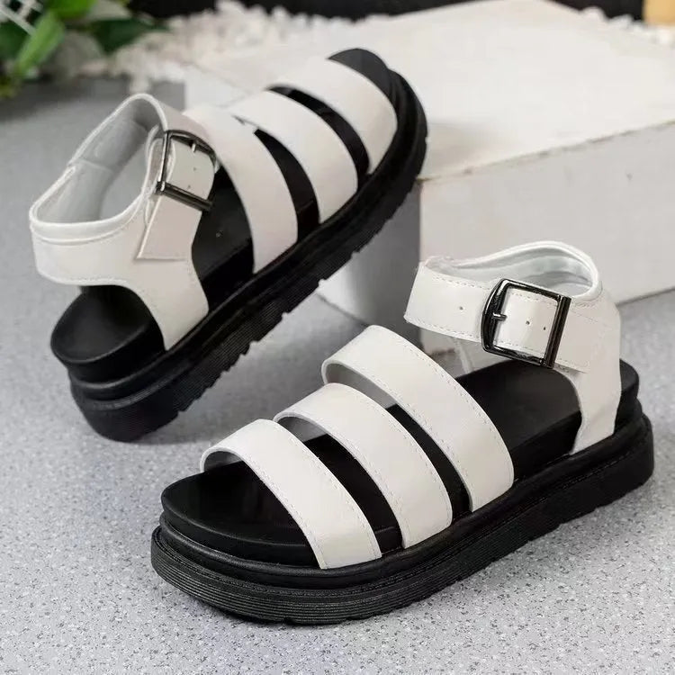 Thick sole buckle strap sandals in black, white, or orange colours showing PU upper and rubber sole
