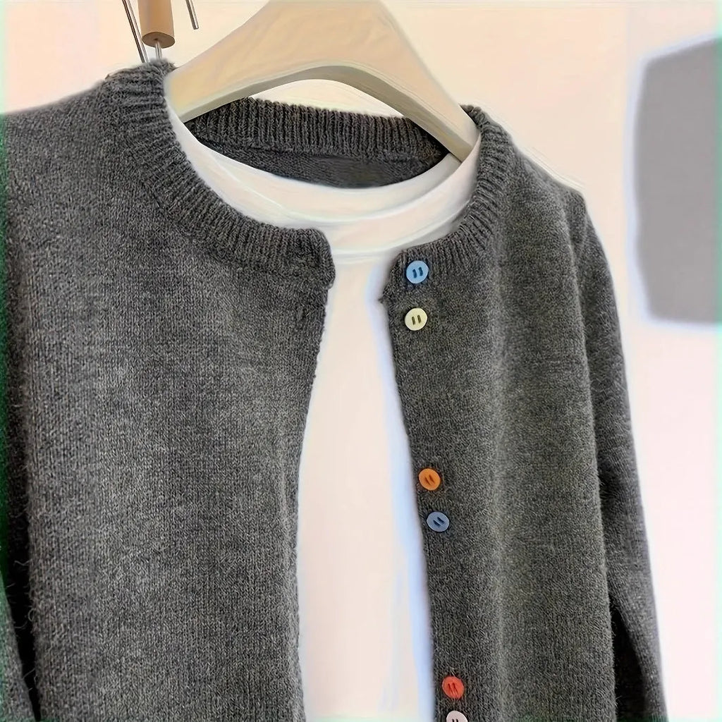 Dark grey solid colour women's cardigan with button front and long sleeves.