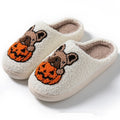 Black and white Halloween pumpkin patterned plush slippers with round toe and TPR rubber soles