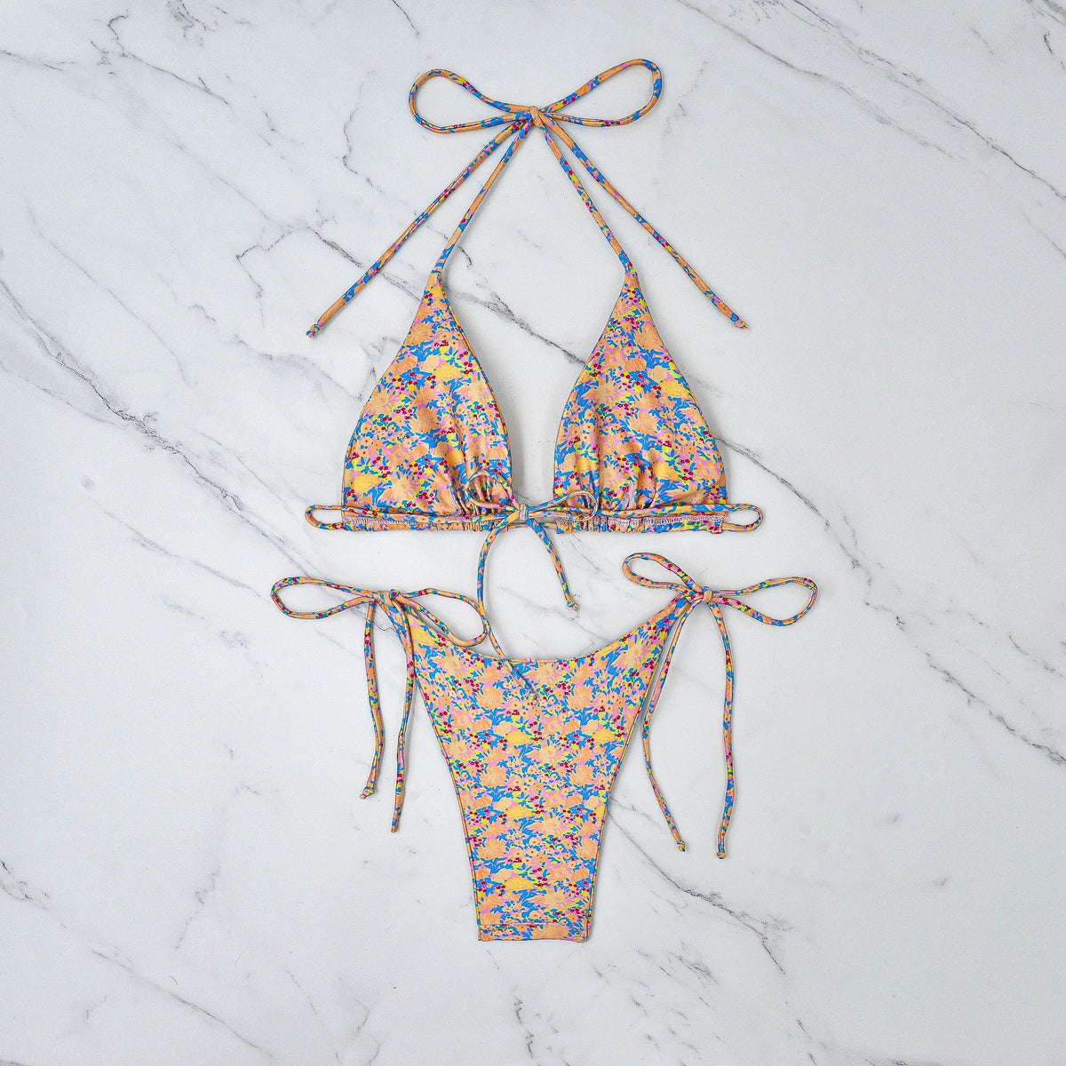 Lace-up bikini swimsuit in picture colour with backless briefs design for swimming.