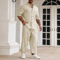 Men's casual apricot-coloured cotton linen short-sleeved shirt and trousers set laid flat.