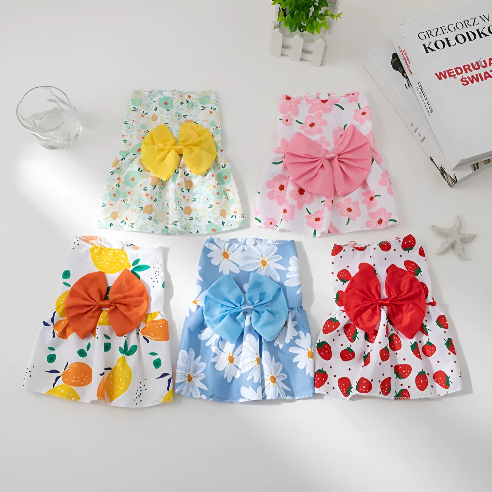 Orange floral butterfly pet dress with decorative bow knot on dog model