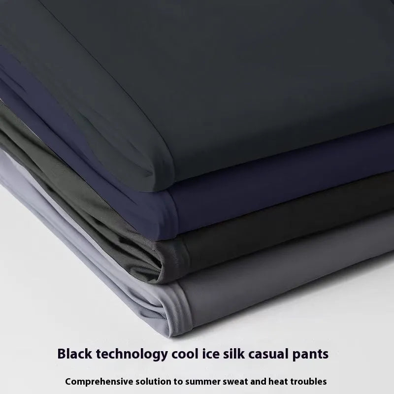 Men's black Ice Silk loose-fit casual trousers with an elasticated waistband on a plain background.