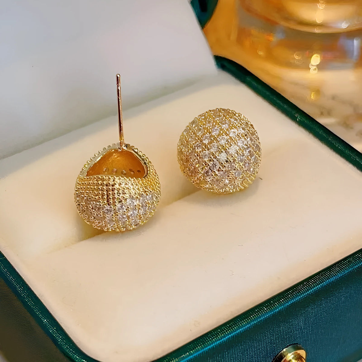 Geometric drop earrings with diamond-encrusted golden beans in gold or white