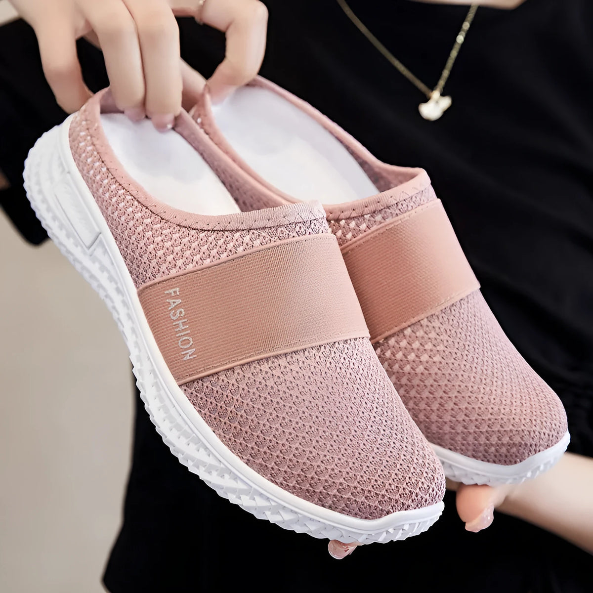 Women's breathable casual shoes with hollow-out mesh upper and flat heel in black, grey, pink, or purple