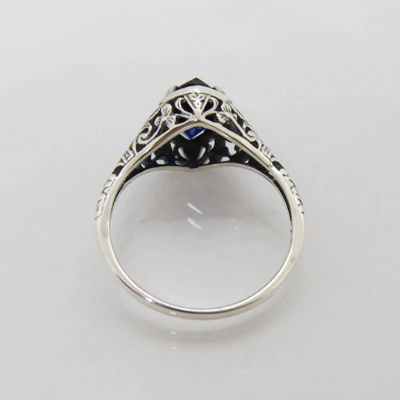 Silver women's ring with geometric hollow pattern, shown in size US7.