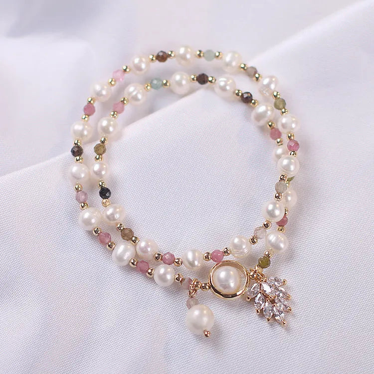 Double layer crystal bracelet with lucky cat charms and red cat's eye flower beads