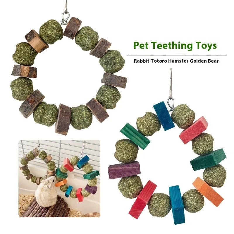 Small pet chew toy showing a ring with a decorative straw ball, in either sequin or applewood style.
