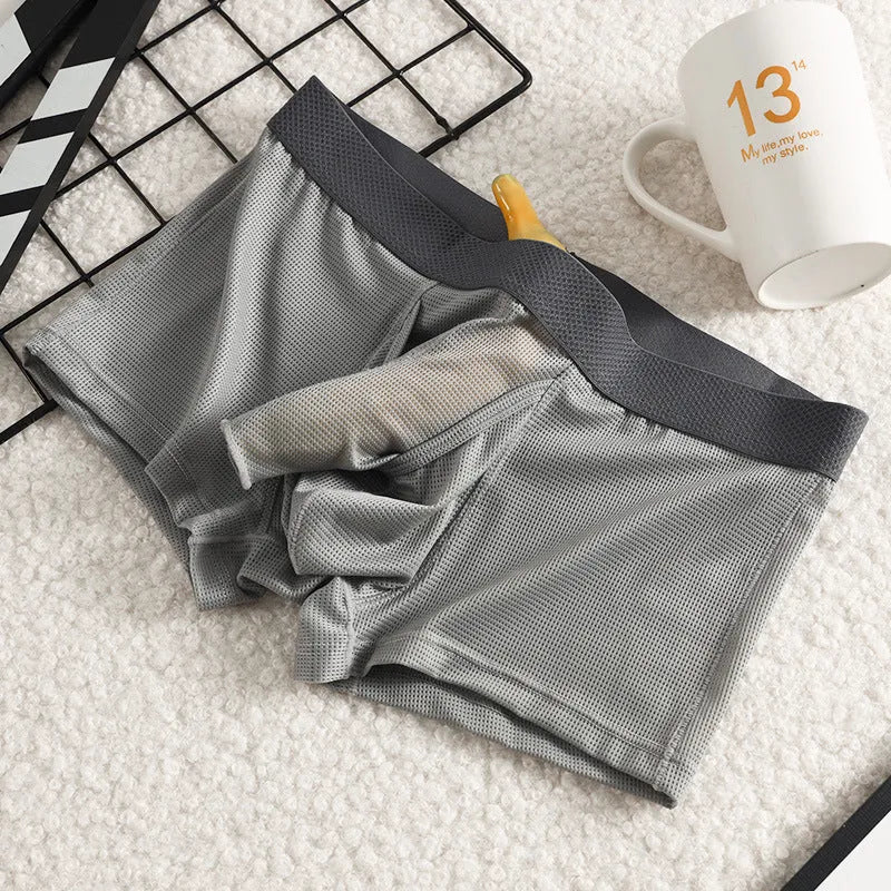 Men's ice silk mesh boxer briefs in black, white, and grey colours showing low waist design