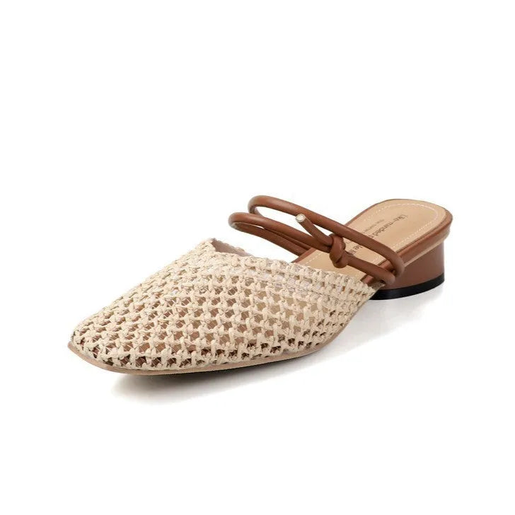 Women's black French-style square toe slippers with hollow-out design and a chunky mid-heel on a rubber sole.