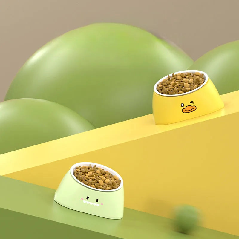 Green 15-degree tilted pet feeding bowl with stainless steel interior and wide PP base for cats and dogs.
