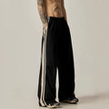 Black wide leg climbing trousers with high waist and straight leg design on hanger