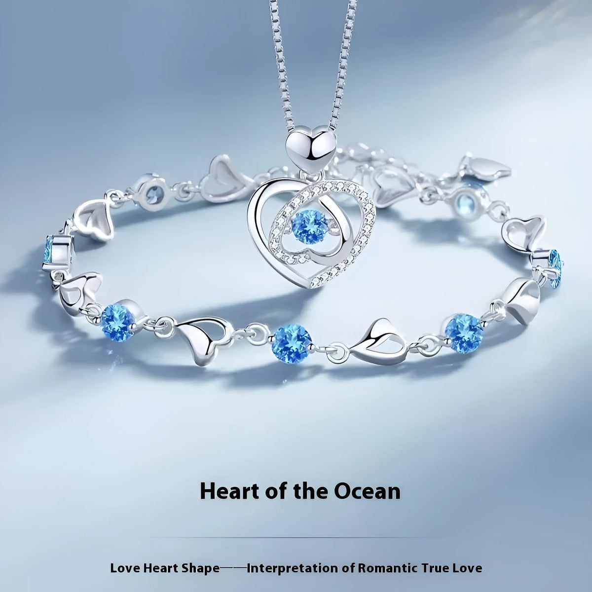 Blue diamond coloured beating heart necklace and bracelet set with gem inlaid pendant on electroplated copper.