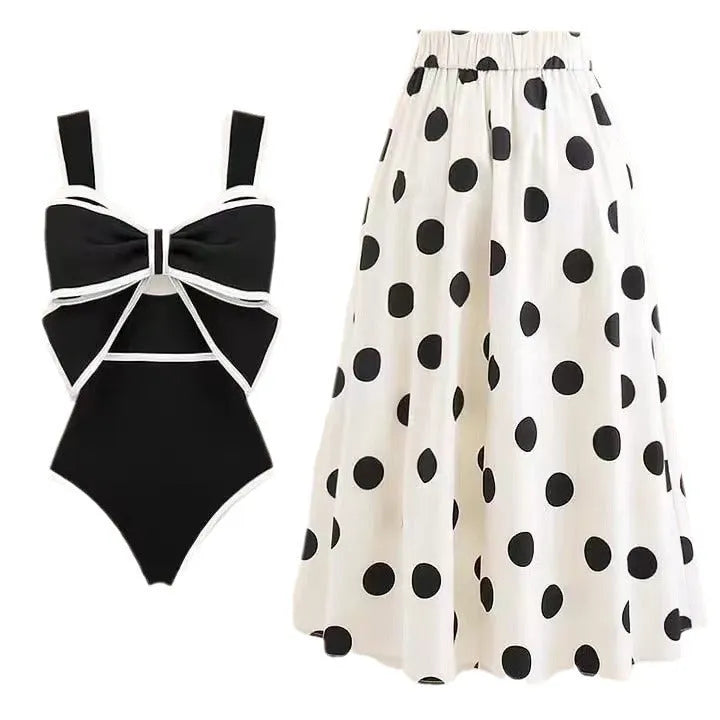 Women's black one-piece swimsuit with white bow and skirt for swimming