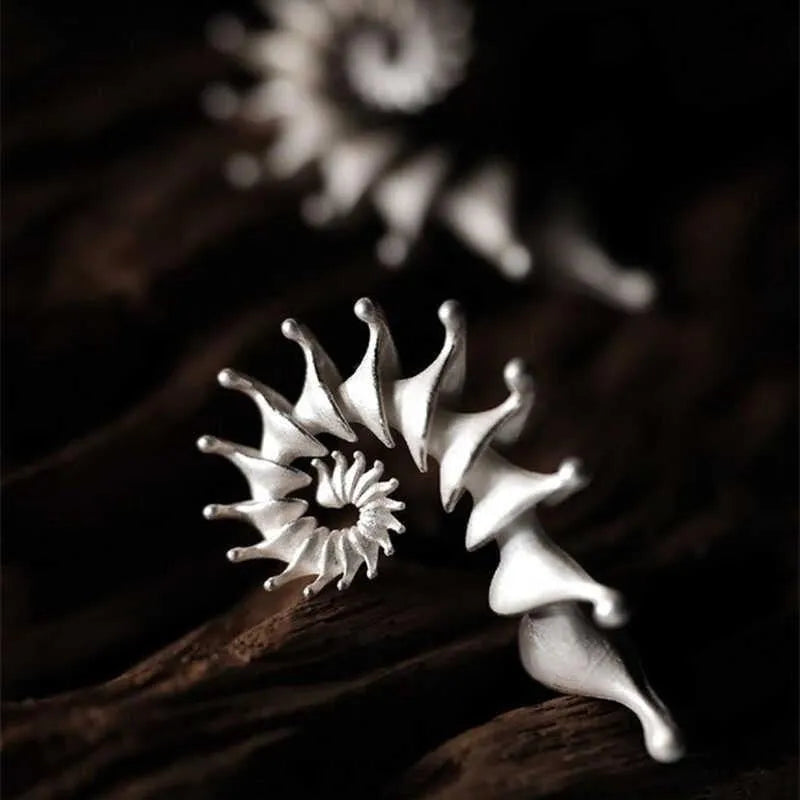 Alloy conch stud earrings with exaggerated three-dimensional shape and matte finish