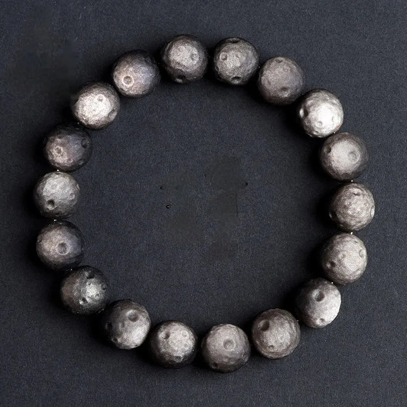 Natural obsidian crater ball bracelet with grinding finish in silver or golden meteorite colours with various bead sizes