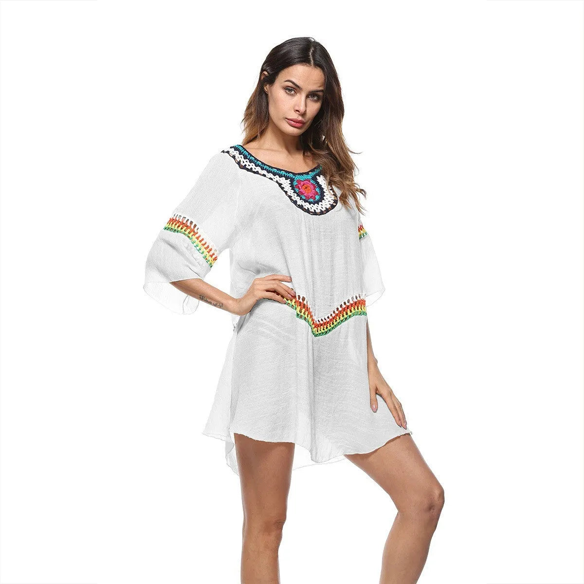 Crocheted ethnic-style beach cover-up for women in apricot colour, made from acrylic fabric.