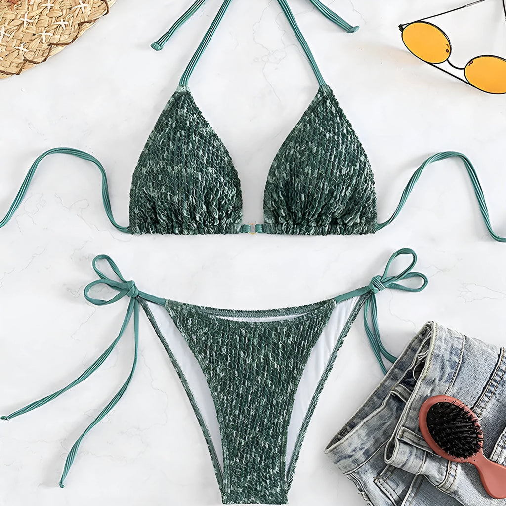 Women's green halter strap backless swimsuit bikini with three-point neck design on mannequin