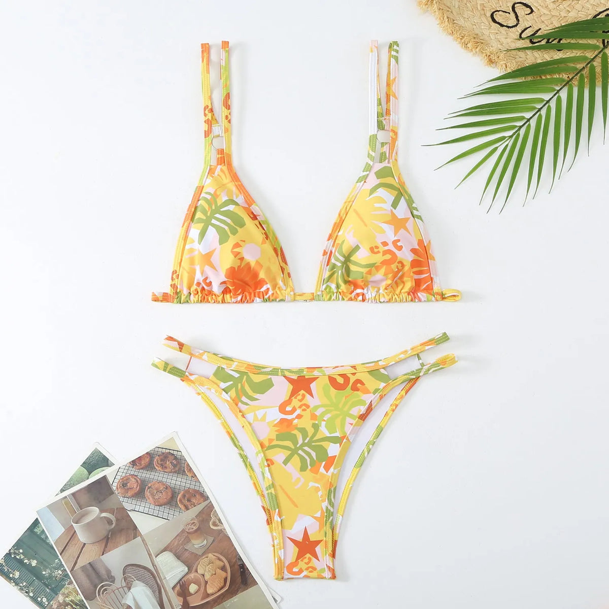 Women's halter top and briefs swimwear set in a floral pattern, shown in blue.