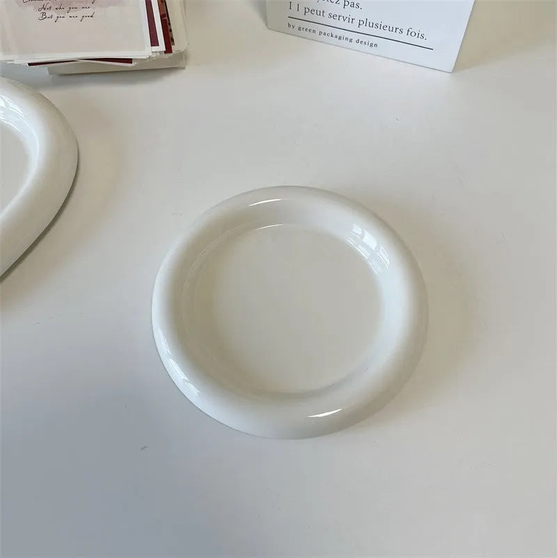 White ceramic plate with chubby toot bear illustration, porcelain potted tray.