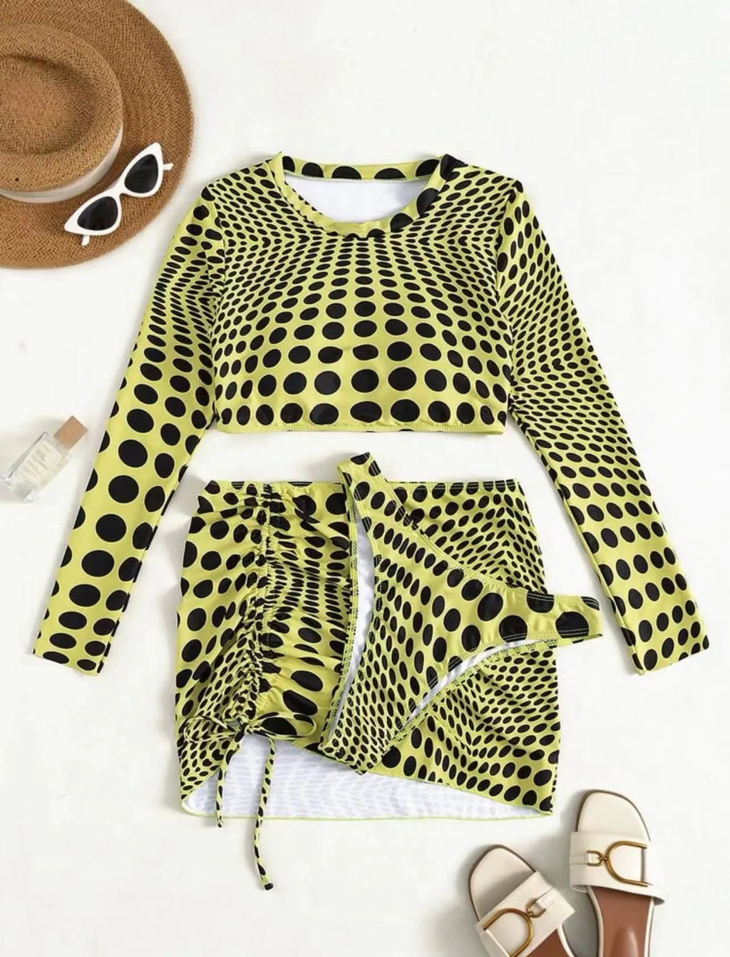 Women's polka dot swimsuit three-piece set in green colour with bra, top, and skirt