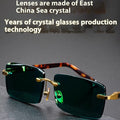 Dark green crystal frameless sunglasses with protective case and cleaning cloth