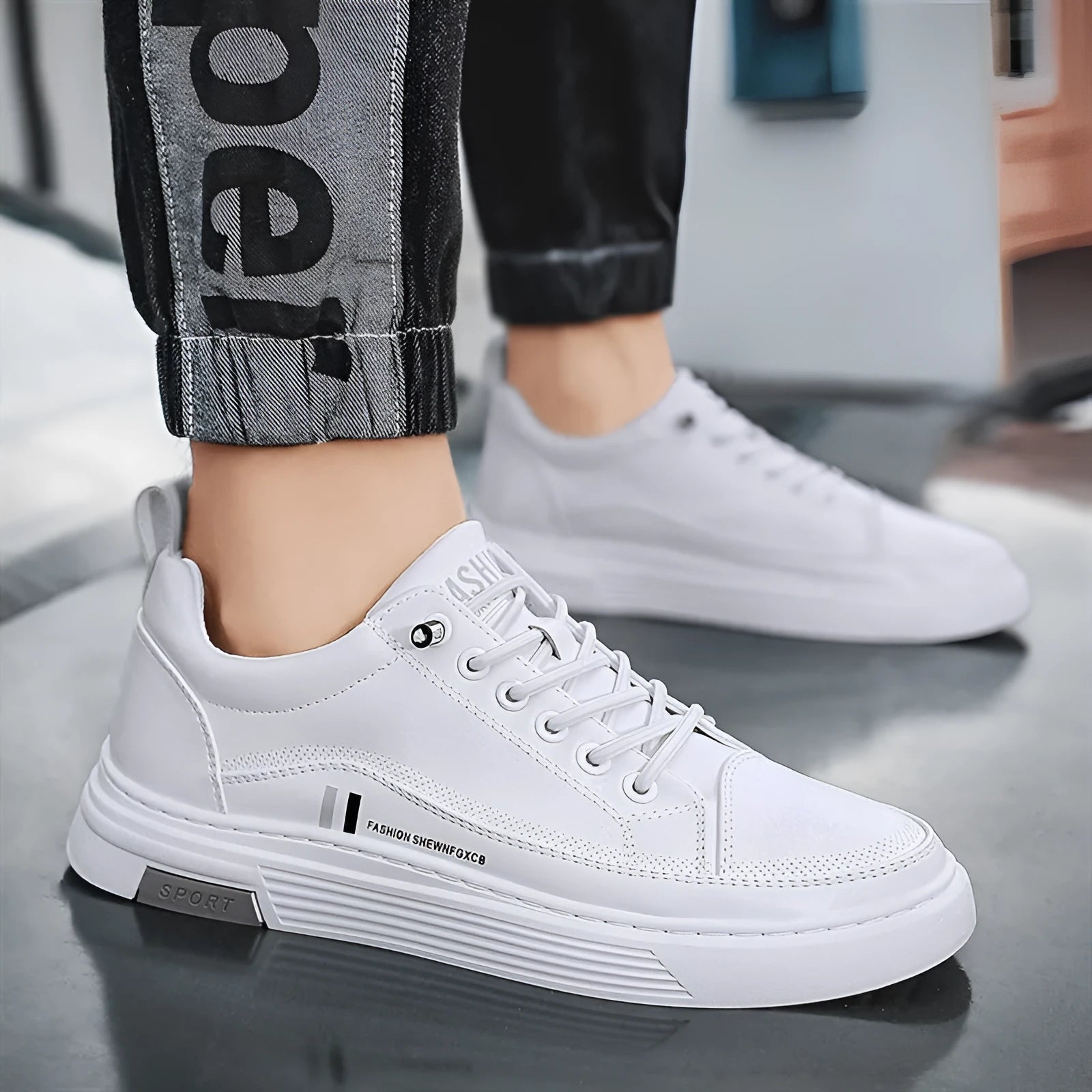 Men's black and white low-top skate shoes with elastic band fastening and rubber sole.