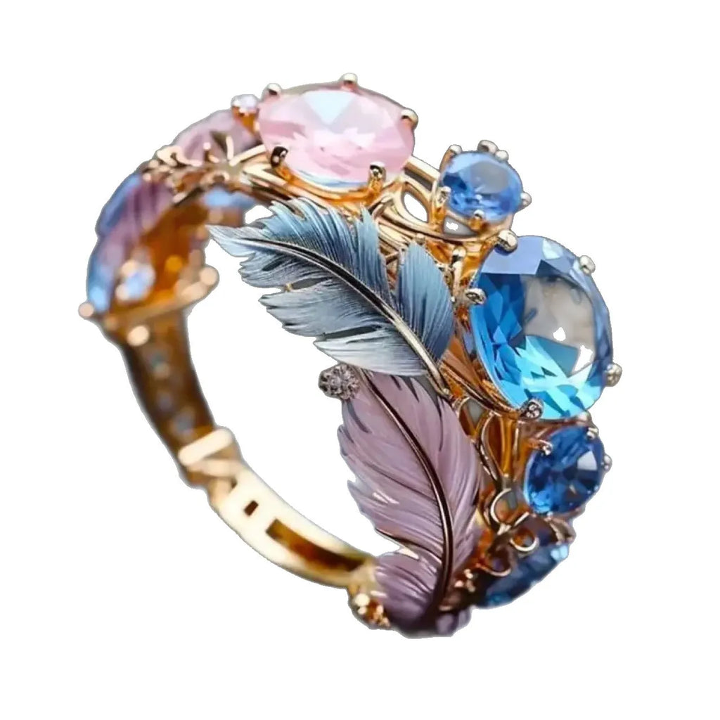 Gold colour brass feather ring with embossed design and inlaid zircon stones