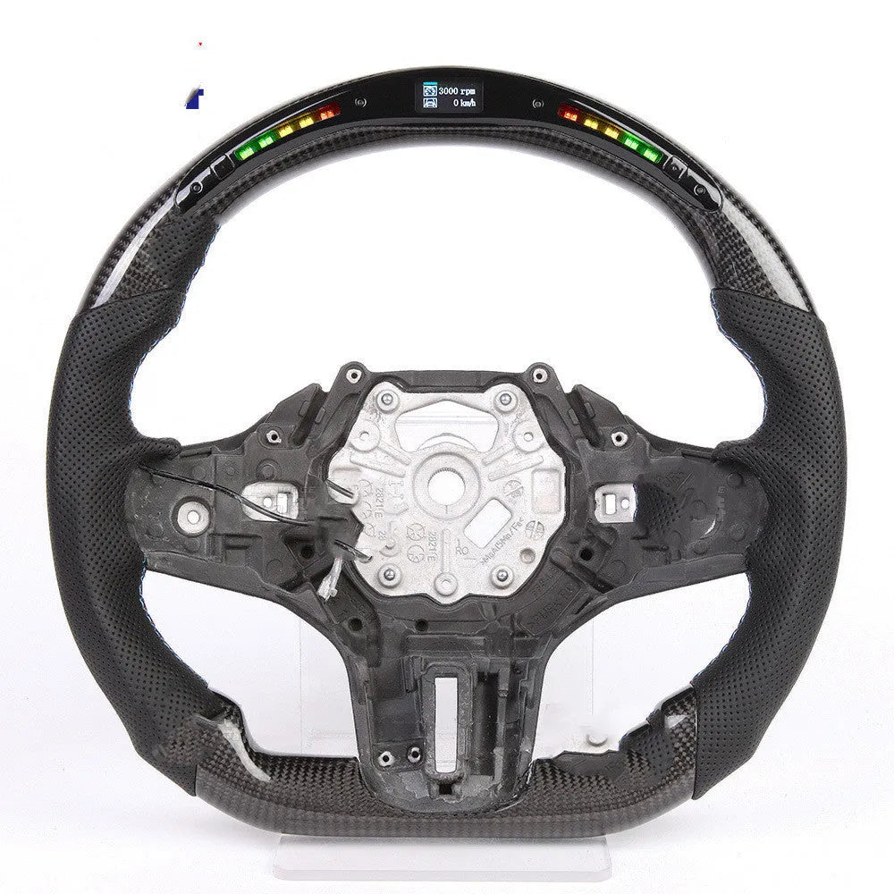 Black carbon fibre steering wheel for BMW with integrated LED display and heating function.