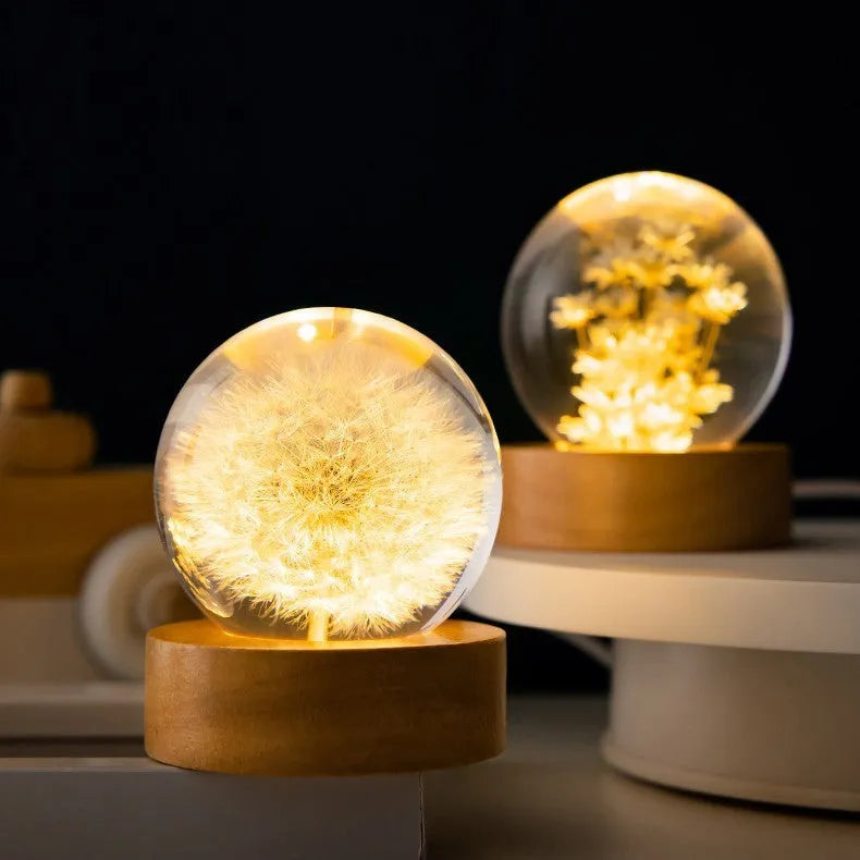 Dandelion preserved flower inside clear resin crystal ball on beech wood stand, functioning as a USB night light.