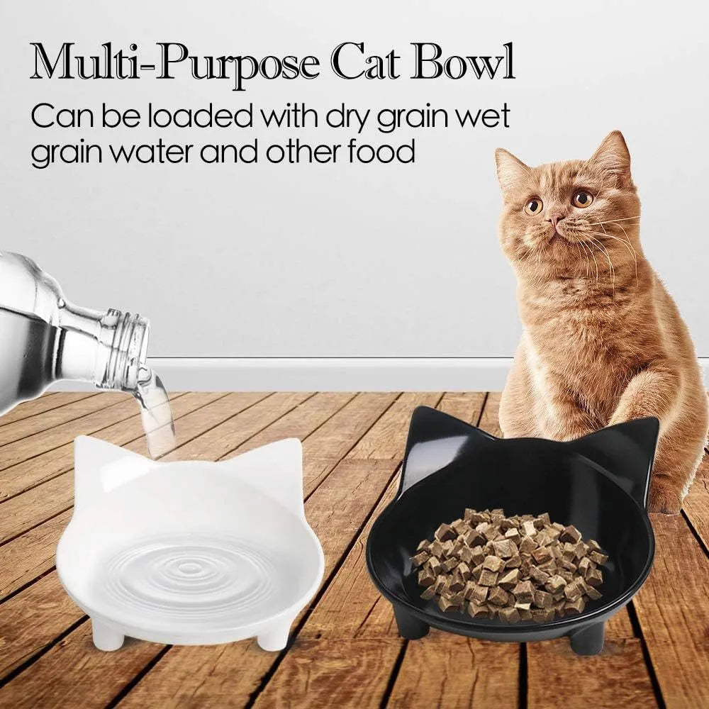 Shallow black melamine pet bowl with a non-slip rubber base on a kitchen floor.