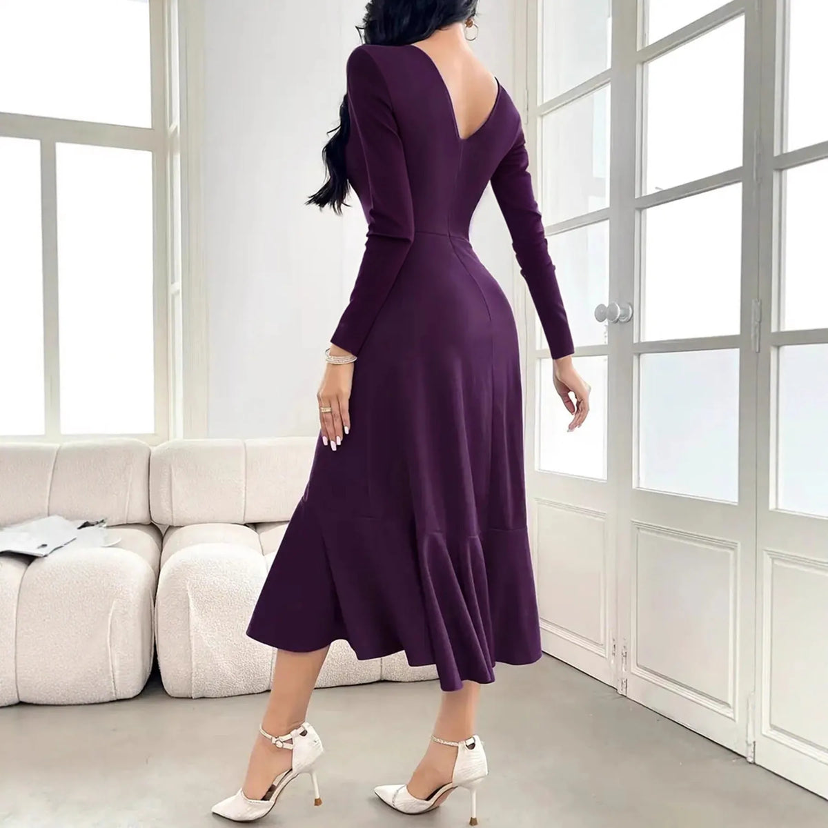 Purple women's long sleeve dress with round neck, ruffles, and a mid waist.