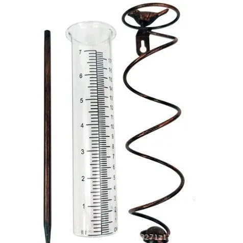 Cast iron hummingbird garden rain gauge with glass tube showing water measurement scale.