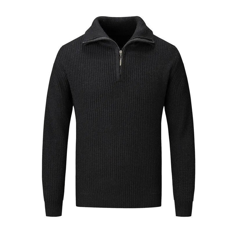 A man's loose-fitting slim pullover jumper in a solid colour, shown in a casual setting.
