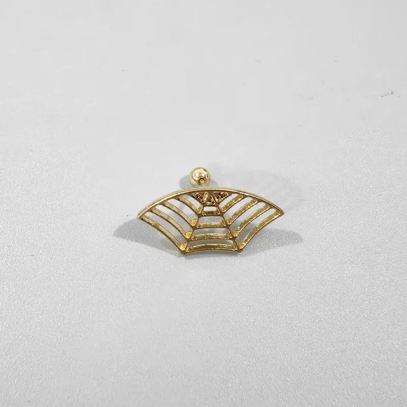 Close-up of metal spider web geometric mesh design stud earrings in a gold electroplated finish.