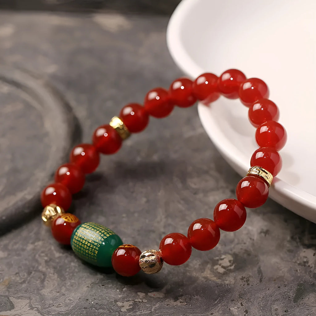 Adjustable unisex Guanyin agate bracelet with auspicious patterns, shown in green and red stone options.