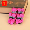 Set of four cloth dog shoes in various colours including fleece-lined red and monkey patterns