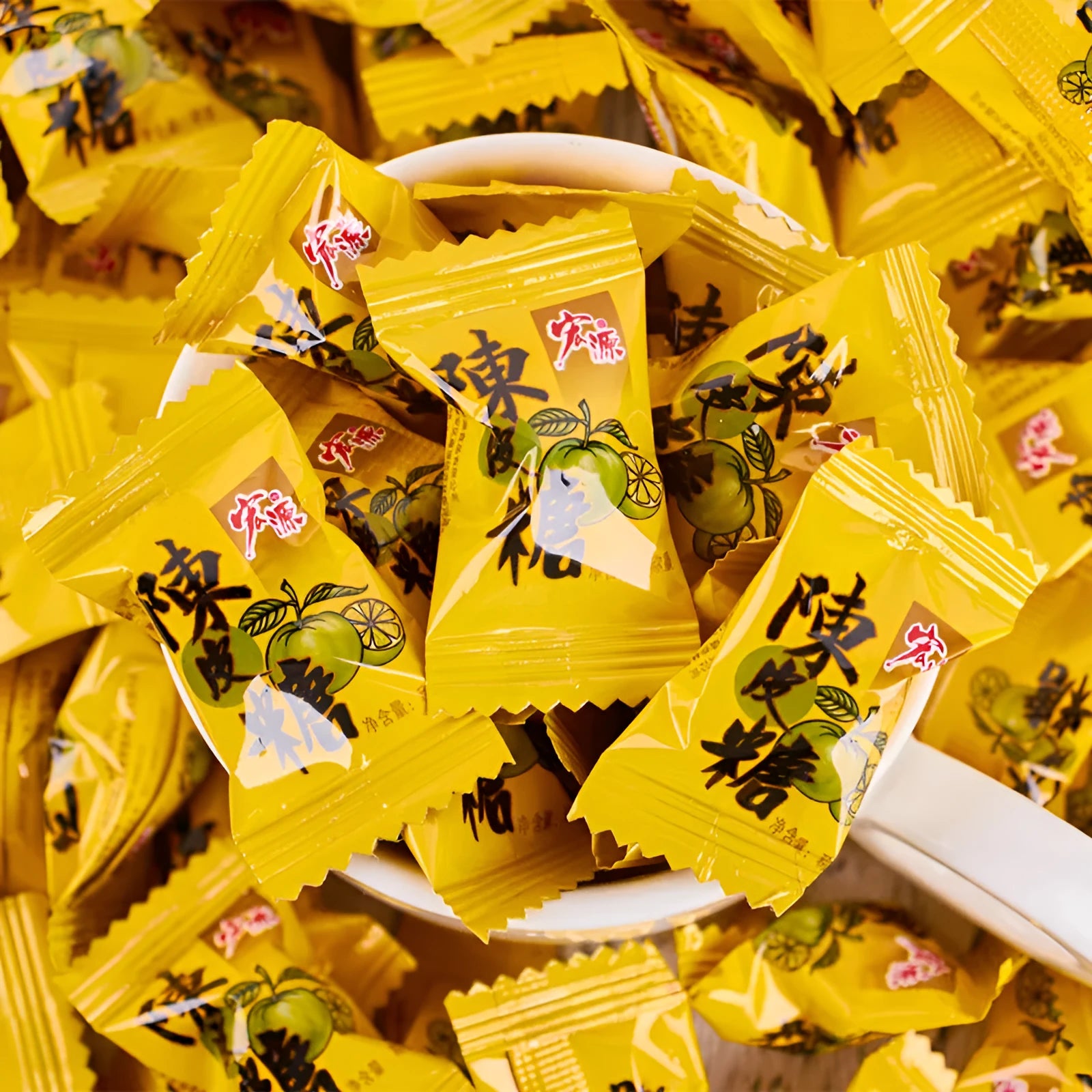 Three bags of hard candy in guava, plum, and tangerine peel flavours with net weights displayed