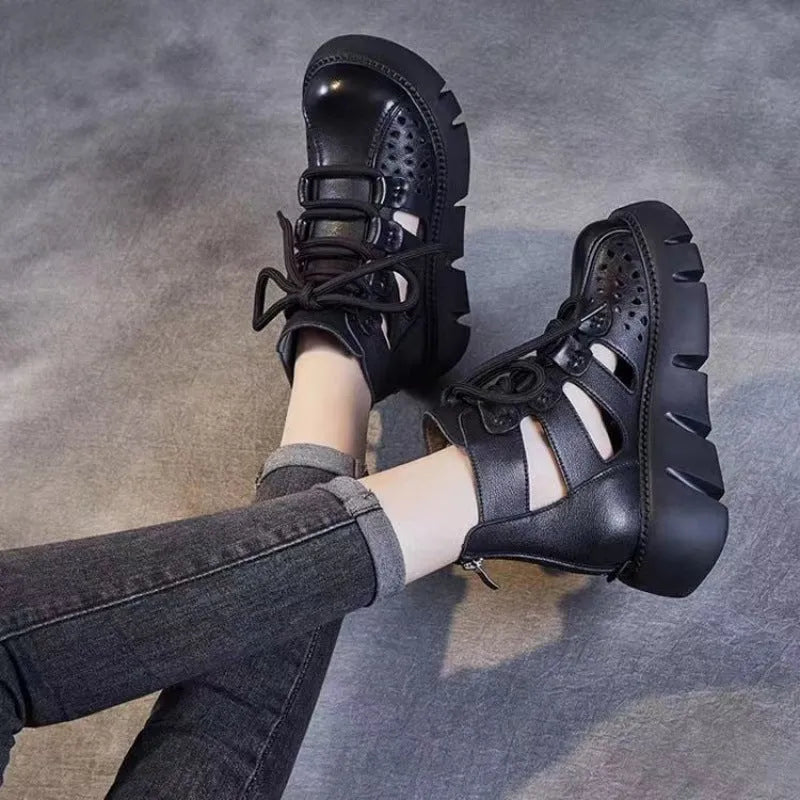 Women's black platform sandals with hollow hole design and fish mouth toe, made from soft leather.
