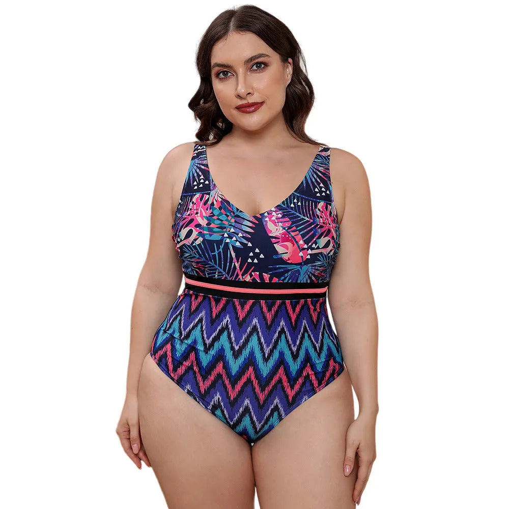 Women's striped vest one-piece swimsuit with spaghetti straps and floral print on blue background.