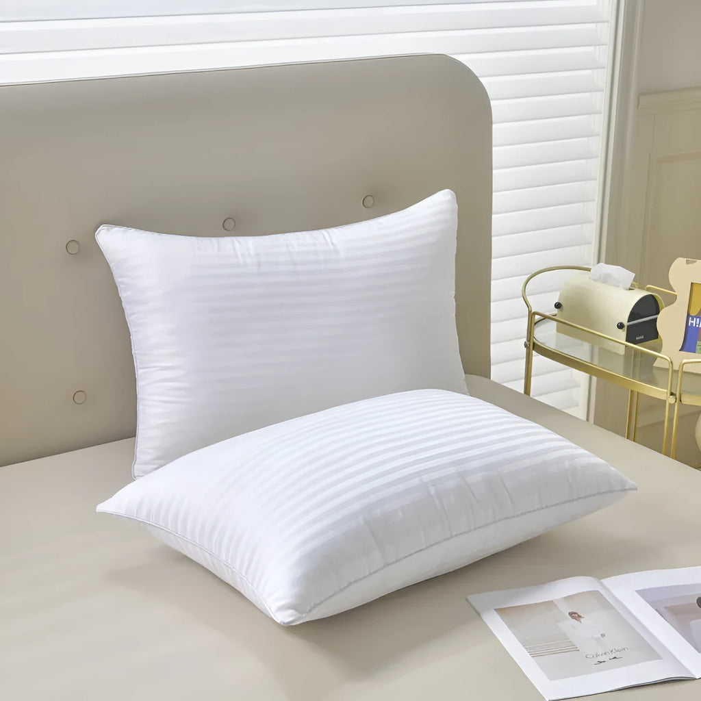 White hotel cotton satin stripe pillow with feather and cotton filling shown in three size options.